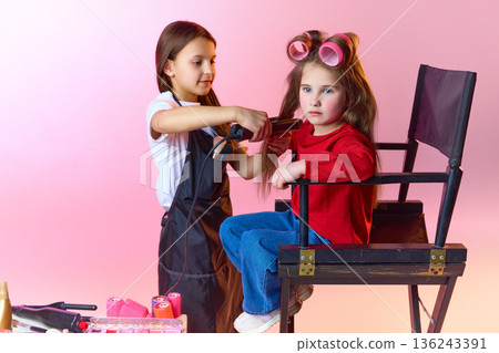 Children playing hair salon and styling hair in studio. Children playing hair salon and styling hair in studio. 136243391