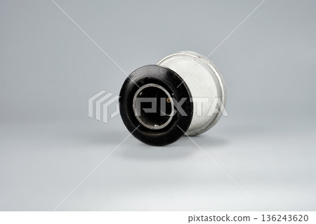 Gas reducer from a portable stove for connection to a gas cylinder on a gray background Gas reducer from a portable stove for connection to a gas cylinder on a gray background 136243620