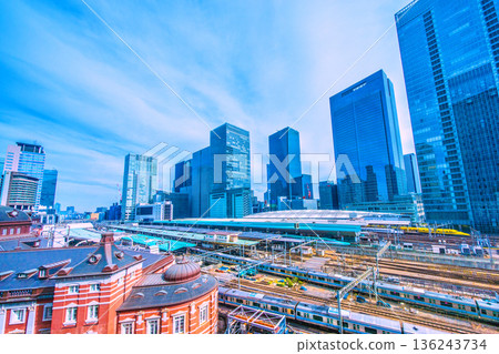 Tokyo cityscape in Japan. View of the Shinkansen bullet train Doctor Yellow, which brings good luck, Tokyo Station, trains, Yaesu and other buildings. 136243734