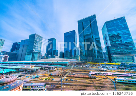 Tokyo cityscape in Japan. View of the Shinkansen bullet train Doctor Yellow, which brings good luck, Tokyo Station, trains, Yaesu and other buildings. 136243736