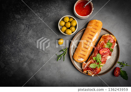 Grilled toast with jamon or prosciutto Grilled toast with jamon or prosciutto 136243959