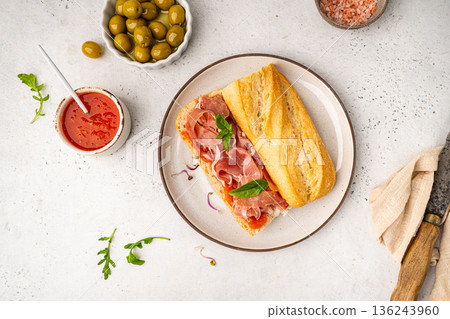 Baguette sandwich with prosciutto or jamon 136243960