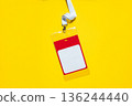 ID badge with lanyard on yellow background. Simple design with space for name or info, symbolizing identity, access, business meetings, or staff registration. Free copy space for design 136244440