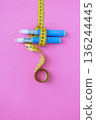 Medical weight loss concept with insulin pens and measuring tape on colorful pink background, symbolizing treatment, diabetes, and obesity control. drugs injection ozempic for weight loss 136244445