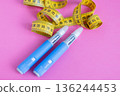 Medical devices for diabetes with tape measure on pink. Illustration of weight loss, insulin therapy, and chronic illness treatment. drugs injection ozempic for weight loss 136244453