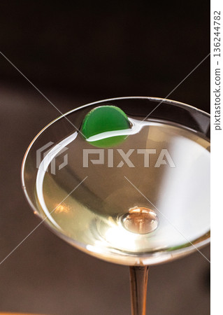 Classic martini cocktail with olive garnish Classic martini cocktail with olive garnish 136244782
