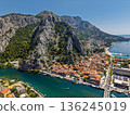 Aerial view of Omis town at Cetina River canyon meeting Adriatic Sea Dalmatia Croatia 136245019