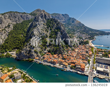 Aerial view of Omis town at Cetina River canyon meeting Adriatic Sea Dalmatia Croatia 136245019