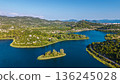Aerial view of Bacina Lakes freshwater lagoon system surrounded by green hills in Dalmatia Croatia 136245028