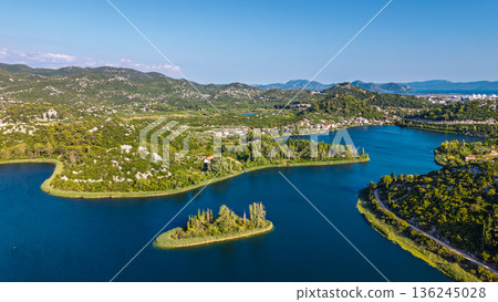 Aerial view of Bacina Lakes freshwater lagoon system surrounded by green hills in Dalmatia Croatia Aerial view of Bacina Lakes freshwater lagoon system surrounded by green hills in Dalmatia Croatia 136245028