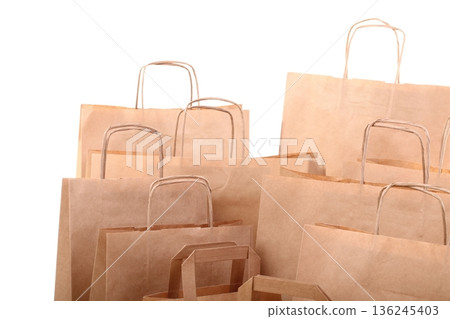 Shopping brown gift bags isolated Shopping brown gift bags isolated 136245403