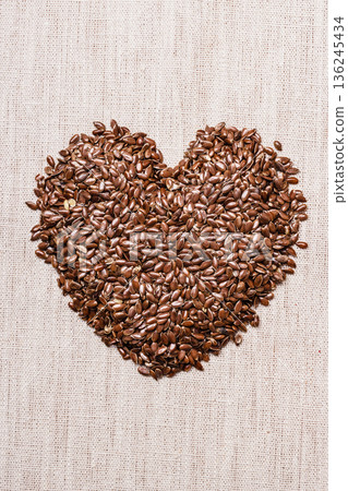 Raw flax seeds linseed heart shaped 136245434
