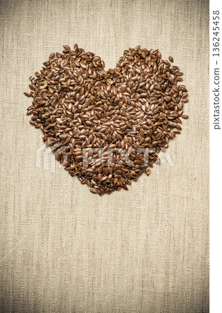 Raw flax seeds linseed heart shaped Raw flax seeds linseed heart shaped 136245458