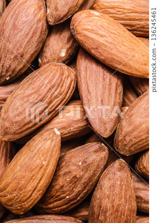 Peeled almonds closeup as background 136245461