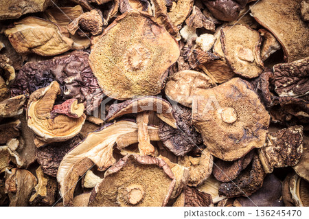 Dry mushrooms as food background Dry mushrooms as food background 136245470