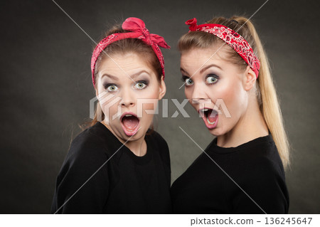 Crazy pin up retro girls making funny faces. 136245647