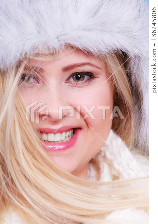 Blonde woman in winter furry hat Blonde woman in winter furry hat 136245806