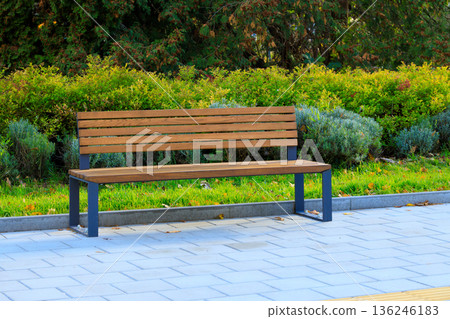 city square bench paved street tile outdoor space sitting place with background green foliage plant city square bench paved street tile outdoor space sitting place with background green foliage plant 136246183