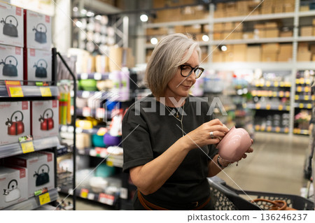 Shopping for kitchenware in a home goods store during a weekend afternoon Shopping for kitchenware in a home goods store during a weekend afternoon 136246237