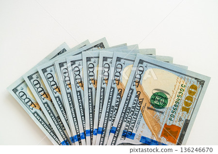 Us dollar cash money isolated on white background, top view. Concept of finance, savings, business, and financial planning. 136246670