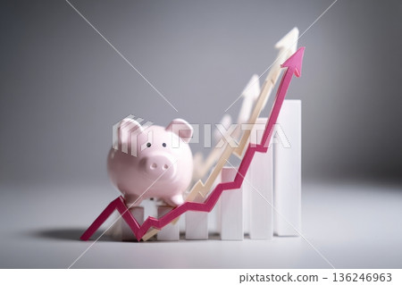A pink piggy bank sits on a rising chart that shows financial growth. The background features bar graphs pointing upward, reflecting progress in finance and saving. A pink piggy bank sits on a rising chart that shows financial growth. The background features bar graphs pointing upward, reflecting progress in finance and saving. 136246963