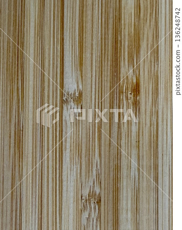A close-up shot of a wooden board. The textured background is made of natural wood. A close-up shot of a wooden board. The textured background is made of natural wood. 136248742