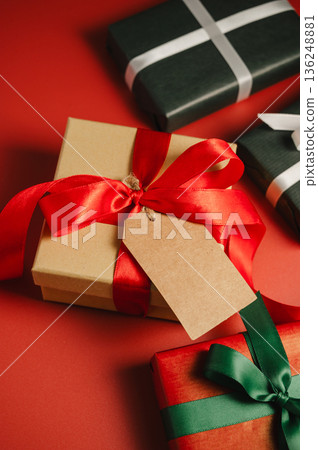 Mothers' day. Gift boxes and fresh red spring tulips. Easter holiday. Red background 136248881