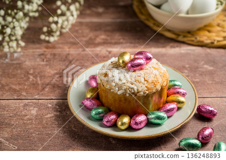 Easter spring holiday background. Cake with chocolate easter eggs, gypsophila flowers  136248893