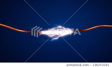 A dramatic illustration of raw electrical power: bright white sparks and an intense arc leap between two bare copper wires. Set against a dark blue background, this image visually represents high A dramatic illustration of raw electrical power: bright white sparks and an intense arc leap between two bare copper wires. Set against a dark blue background, this image visually represents high 136253281