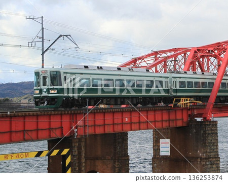 A replica Nankai Hawks train crossing a railway bridge 136253874