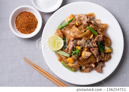 Thai food (Pad See Ew), Stir-fried rice noodles with soy sauce, pork, egg, and kale Thai food (Pad See Ew), Stir-fried rice noodles with soy sauce, pork, egg, and kale 136254751