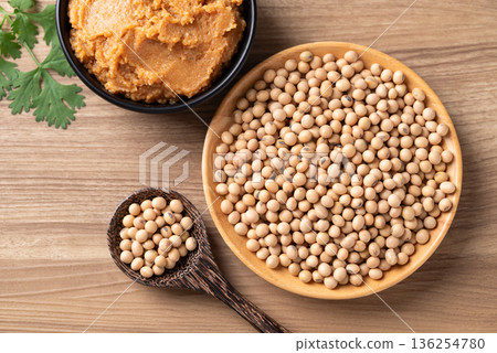 Top view of raw organic soybeans and miso paste on a rustic wooden table Top view of raw organic soybeans and miso paste on a rustic wooden table 136254780