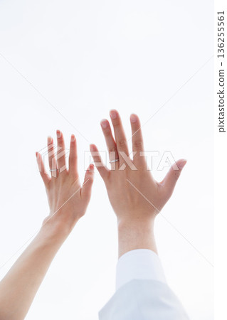 Photo of a man and woman's hands with wedding rings. Image of a couple. 136255561