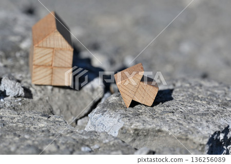 Image of a house collapsing due to a disaster (various insurance) 136256089