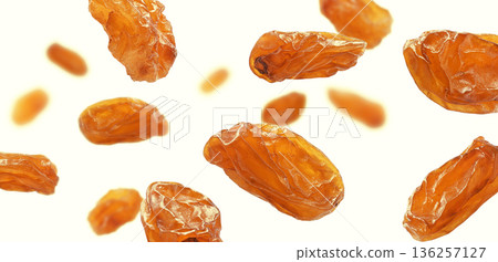 A stunning display of dried raisins elegantly arranged on a light and bright background 136257127