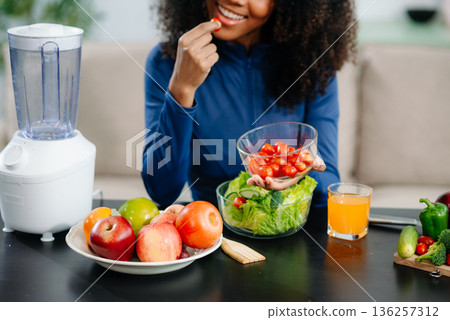 Healthy cooking, featuring fresh fruits, vegetables, and a blender. Perfect for themes of nutrition, wellness Healthy cooking, featuring fresh fruits, vegetables, and a blender. Perfect for themes of nutrition, wellness 136257312