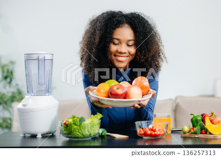 Healthy cooking, featuring fresh fruits, vegetables, and a blender. Perfect for themes of nutrition, wellness Healthy cooking, featuring fresh fruits, vegetables, and a blender. Perfect for themes of nutrition, wellness 136257313