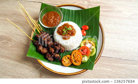 Traditional Asian Meal Served on Banana Leaf 136257684