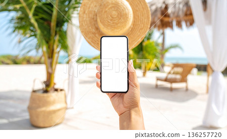 Woman Holding Smartphone Outdoors Near Swimming Pool Woman Holding Smartphone Outdoors Near Swimming Pool 136257720