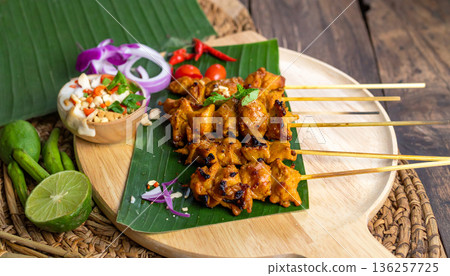 Grilled Chicken Satay with Peanut Sauce and Lime 136257725