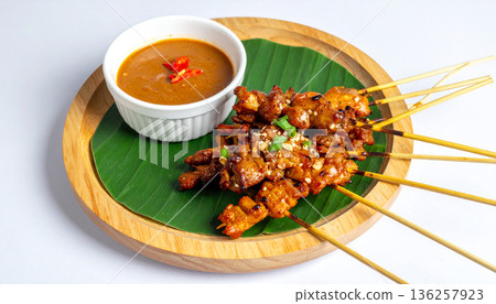 Indonesian Chicken Satay with Peanut Sauce 136257923