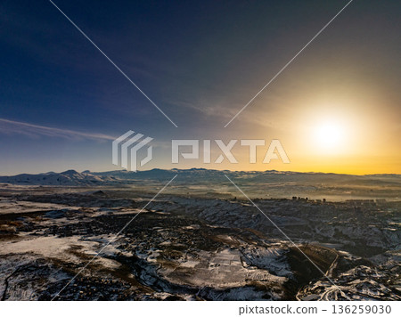 A beautiful, serene landscape with a large mountain range in the background A beautiful, serene landscape with a large mountain range in the background 136259030