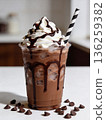 A chocolate drink with whipped cream and chocolate drizzle on top 136259382