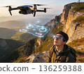 A man is looking at a drone flying in the air 136259388