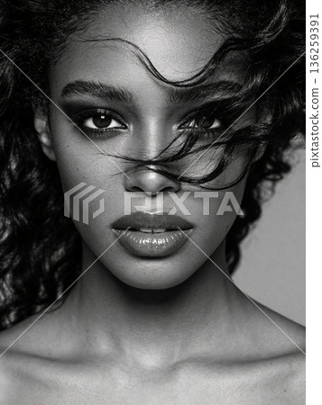 A woman with long hair and a black and white photo A woman with long hair and a black and white photo 136259391