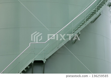 Image of stairs and shadow of a large oil tank Image of stairs and shadow of a large oil tank 136259585
