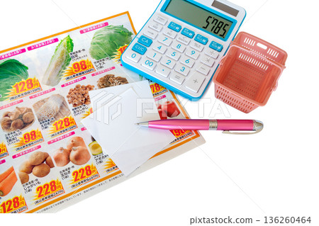 Image of taking note of special offers while looking at a newspaper insert flyer Image of taking note of special offers while looking at a newspaper insert flyer 136260464