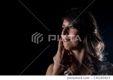 Reflective lady portrait, Elegant woman adorned in flowers in tranquil cinematic ambiance, Pensive lady dressed with blossoms captured in calm cinematic environment lighting Reflective lady portrait, Elegant woman adorned in flowers in tranquil cinematic ambiance, Pensive lady dressed with blossoms captured in calm cinematic environment lighting 136260923