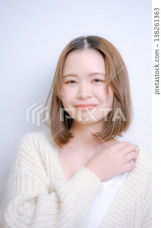 Woman in white knit Woman in white knit 136261363