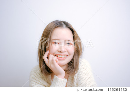 Woman in white knit Woman in white knit 136261380
